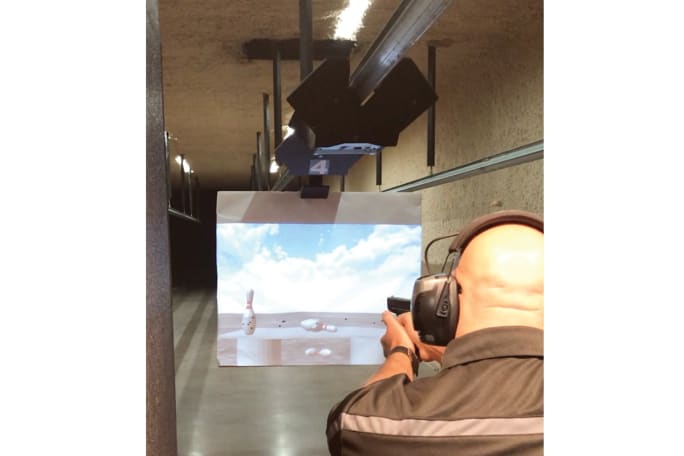 Installing Meggitt Training Systems’ XWT ProImage projected target system allows you to use still and video image projection on paper at the range instead of traditional paper targets.[|CREDIT|]Photo: Meggitt Training Systems