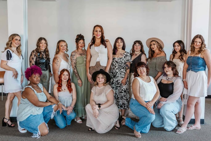 The team from Posh Salon and Boutique dressed in denim and light colors.