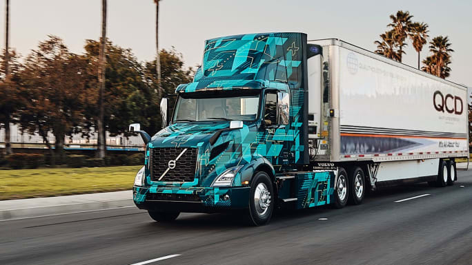 Volvo electric truck pulling QCD trailer