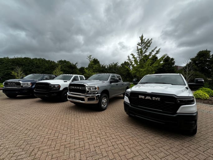 Lineup of commercial pickups in parking lot. 