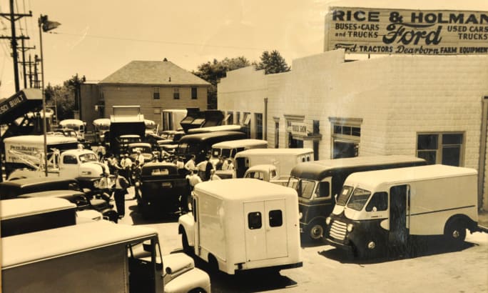 A black and white photo of Rice & Holman is shown.