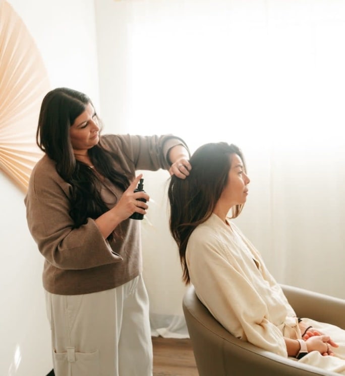 A stylist and client at Rind Head Spa.