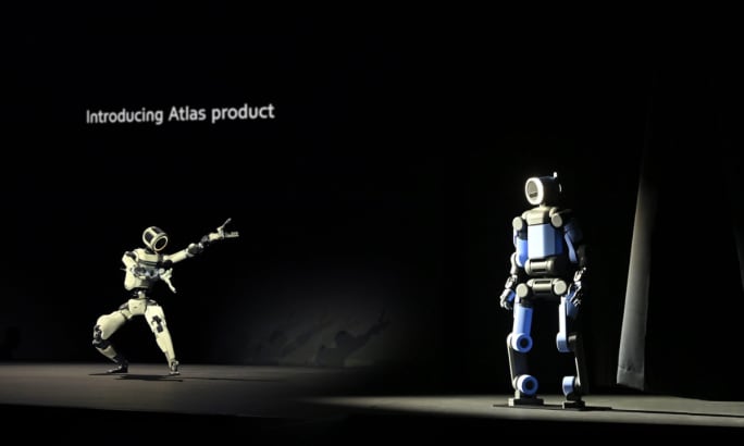 Hyundai presentation showing humanoid robots during a product demonstration highlighting the company’s investment in robotics and future mobility technologies.