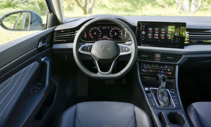 Interior of a 2025 Volkswagen Jetta's front seat view of the wheel and dashboard.