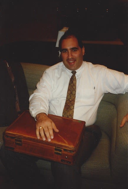 Old scanned image of a younger Matthew Betz in professional attire.