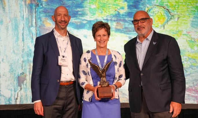 Sharon Etherington accepts the 2024 Fleet Manager of the Year award on stage at the AFLA conference.