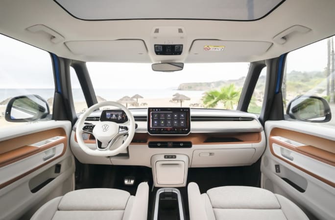 The front interior of a Volkswagen ID. Buzz in the color Dune. 