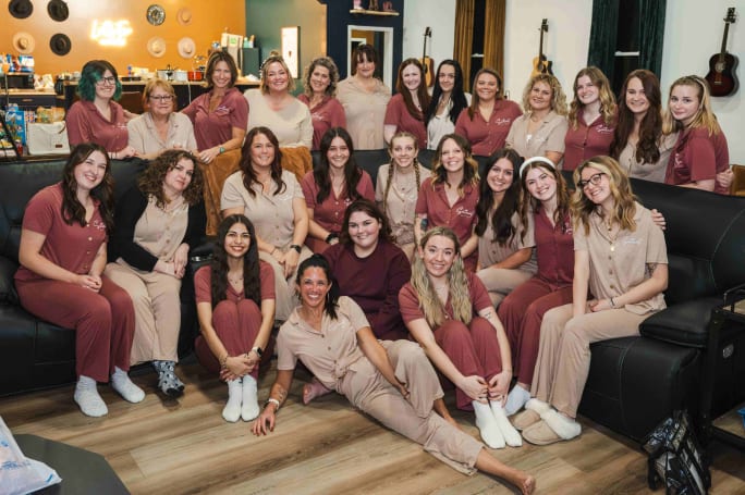 Dressed in matching pajamas, the team from Southwest Hair & Day Spa