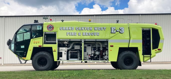 A bright yellow ARFF operated by Grand Canyon West Airport is shown.