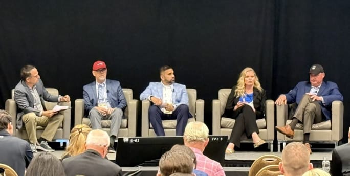 Photo of panelists on stage.