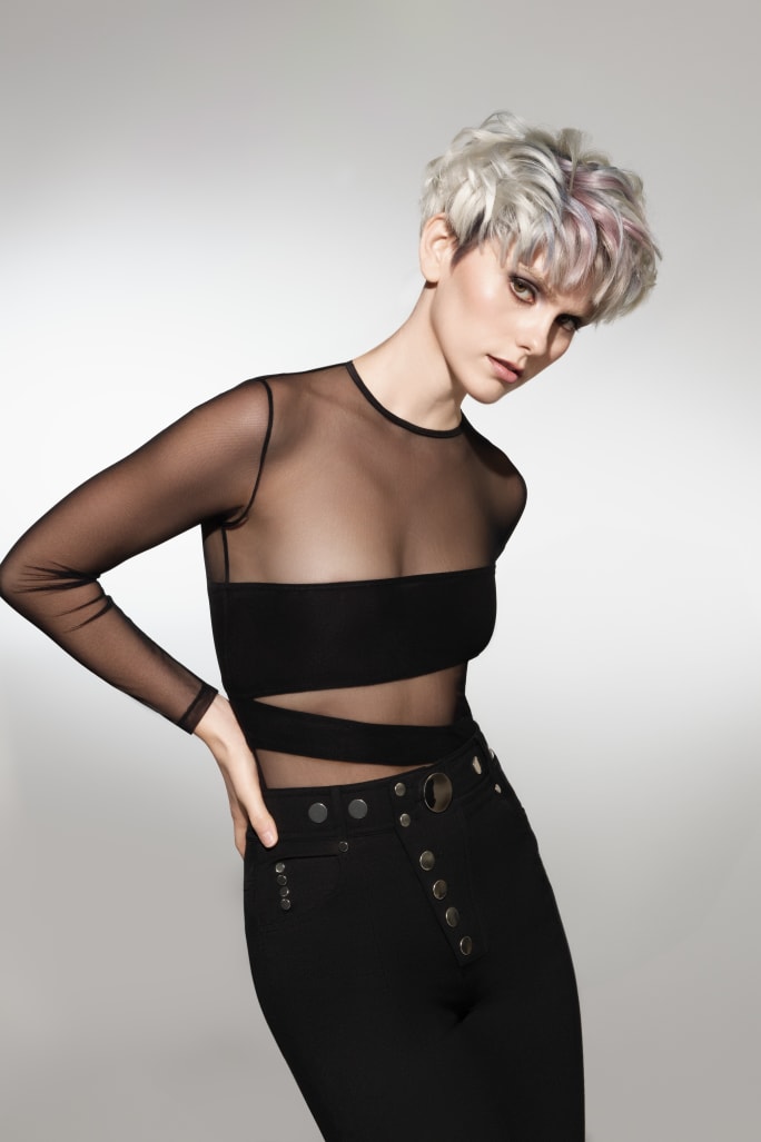 A woman with short white blonde hair