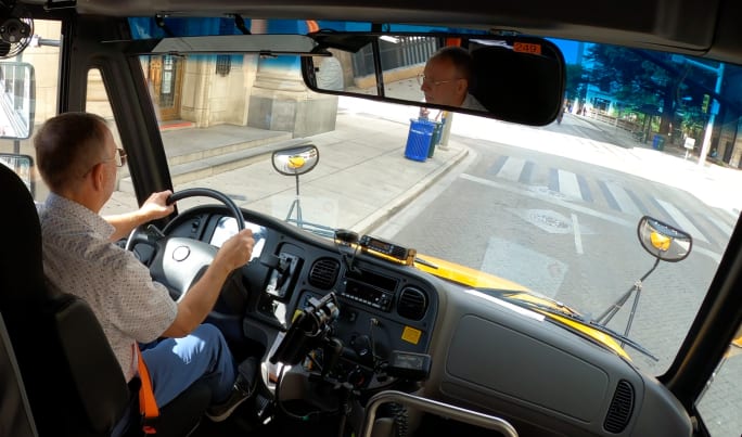 a man drives a school bus