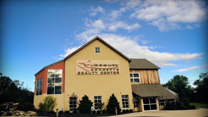A beautiful education center surrounded by blue sky.