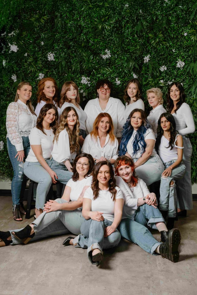 Posing in white shirts and jeans, the team from Utopia Salon