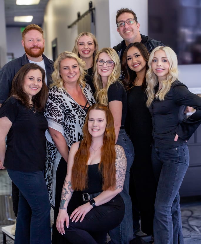 Team members from Vault Salons pose.