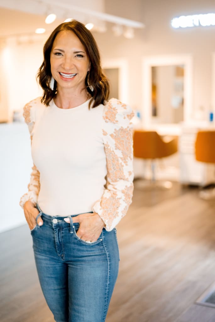 Owner Amy Pal smiles in one of her Whip Salon locations.