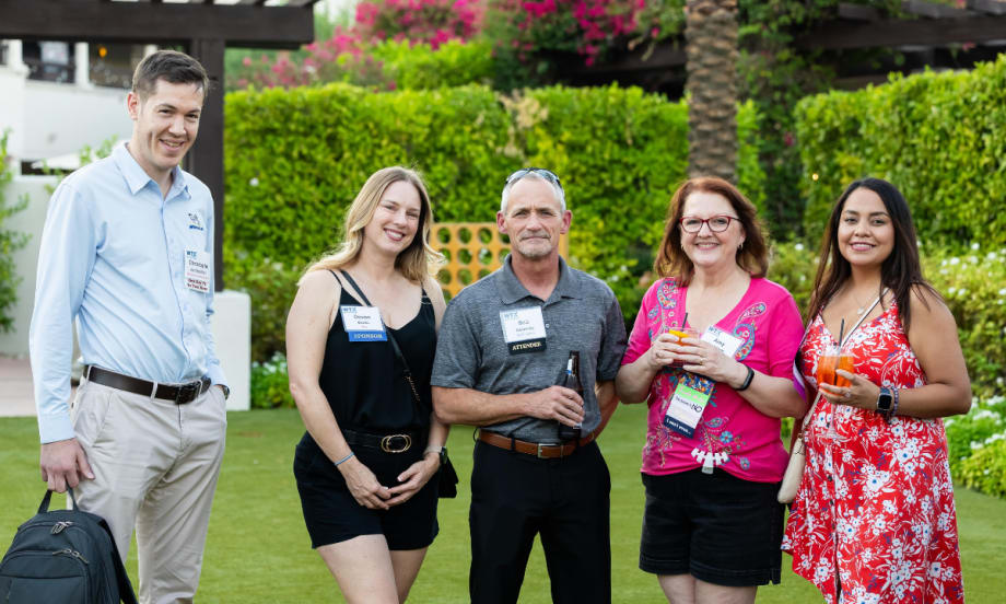 Work Truck Exchange attendees gather outdoors during an evening networking reception at The Scottsdale Resort & Spa.