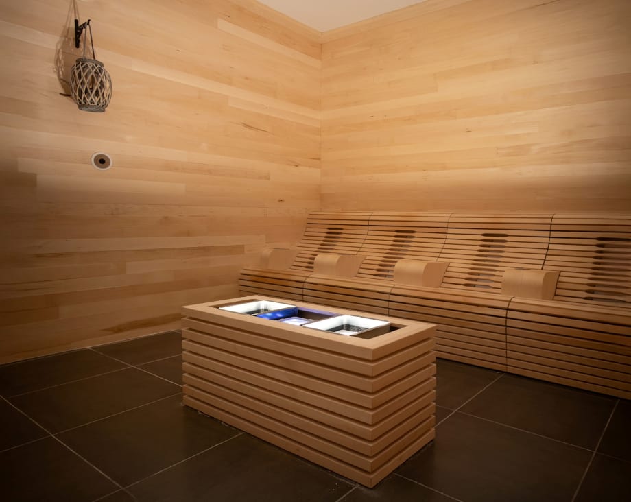 A wood paneled Sabbia Med Room in Excuria Salon and Spa.