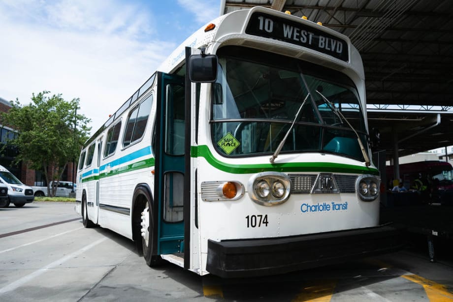 An preserved white and green older CATS transit bus.