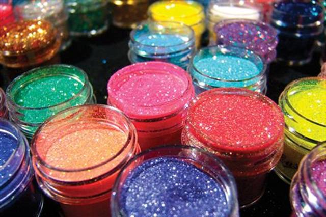 How can nail techs be sure they aren’t compromising the strength of an enhancement by adding too many embellishments?