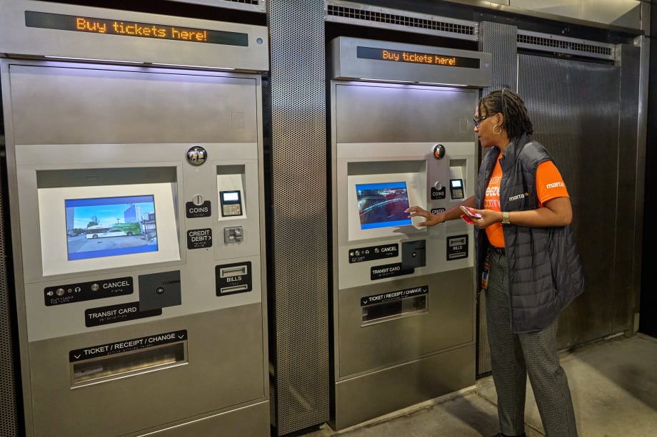 A MARTA employee using the new Better Breeze fare ticket machines.
