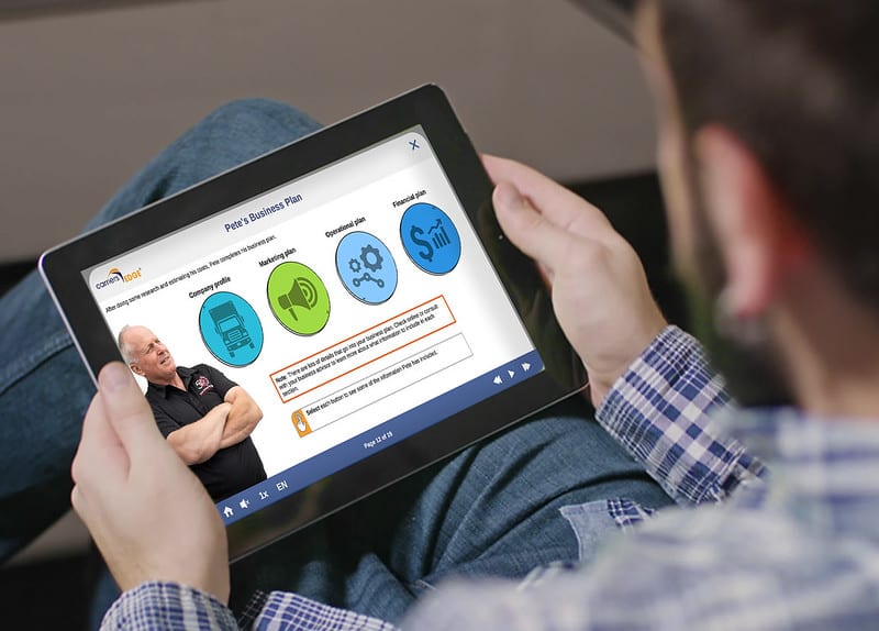 Man looking at training course on electronic tablet