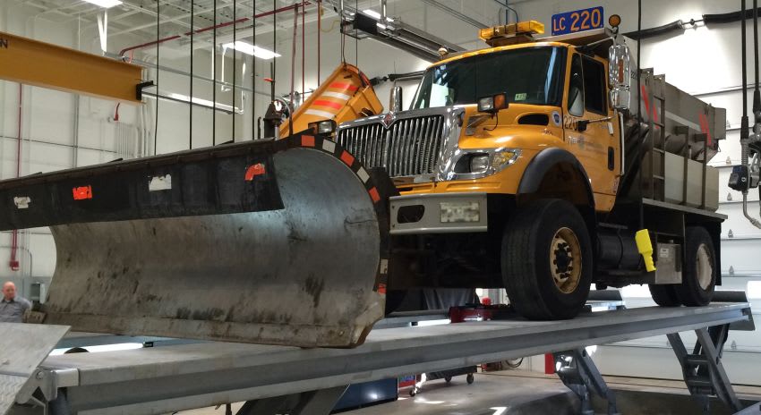 Stertil-Koni SKYLIFT-Washbay model lifts a Snow Plow