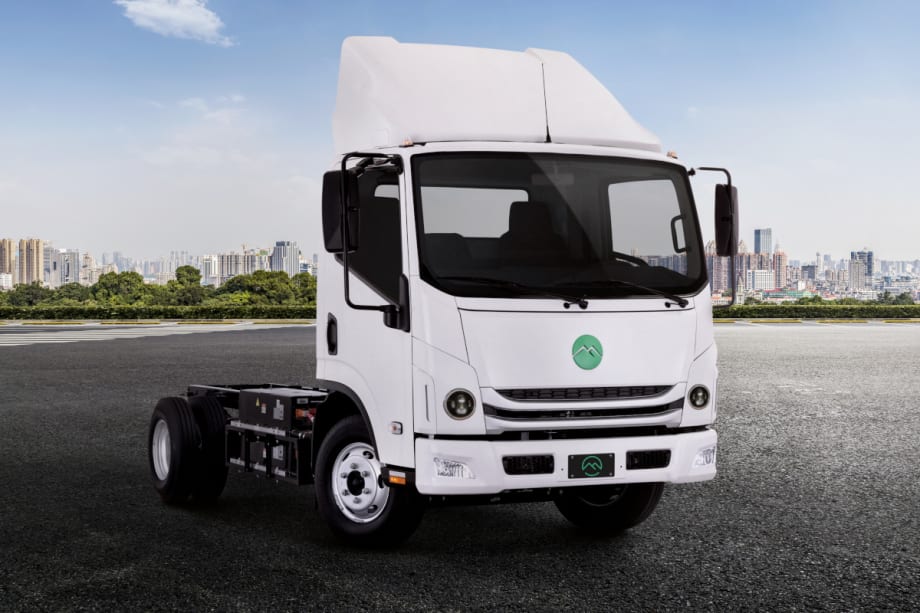 A Mullen Three battery-electric truck is shown from the front at a 3/5 angle to display the truck cab and the chassis.
