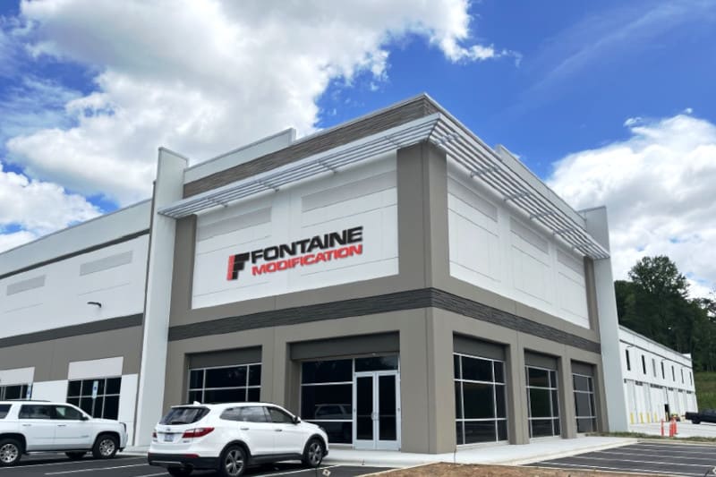 Photo shows a business building with the name Fontaine Modification above the entrance doors.