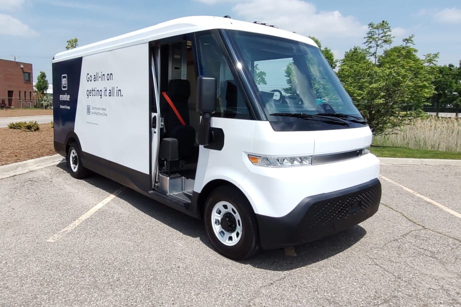 White EV cargo van is shown from the front quarter angle.