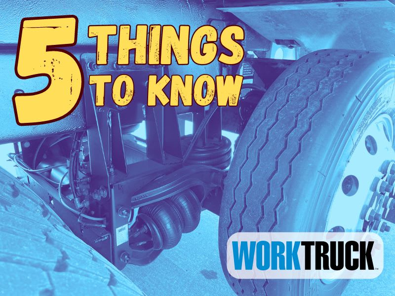 Blue-tinted image of a close-up photo of a truck tire and suspension for a lift axle. Top left has 5 Things to Know in large yellow type.