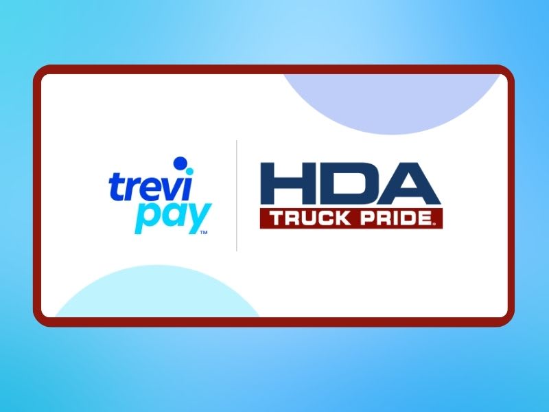 White sign shows logos for two companies, TreviPay and HDA Truck Pride, against a blue background.
