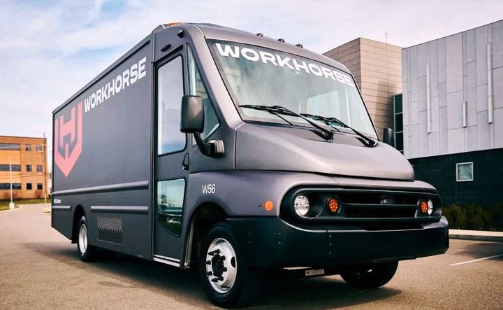 A black step van with Workhorse logo parked in a lot.