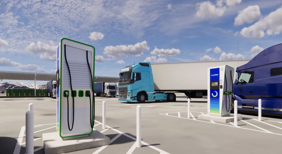 Electric-truck charging station with aqua cabover tractor-trailer in background
