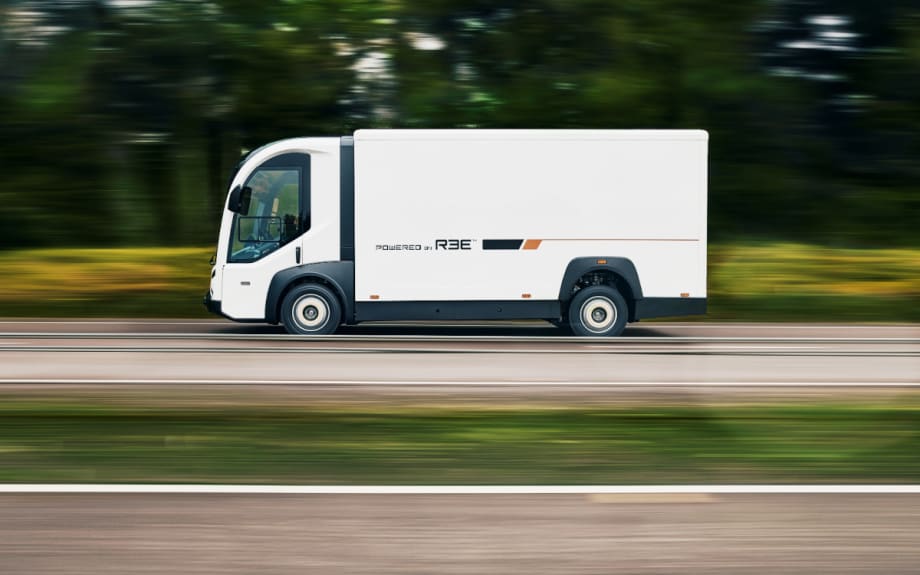 Side view of a white battery-electric truck.