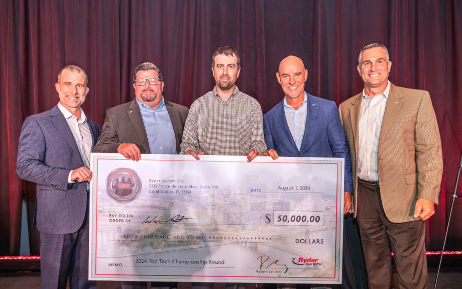 Group of five men holding a large check for $50,000.