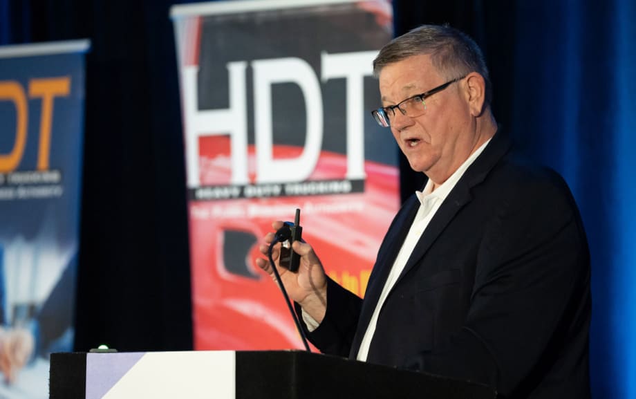 FMCSA former official Jack Van Steenburg at HDTX podium with HDT backkdrop
