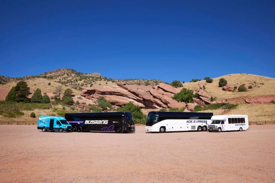 A Bustang and ACE Express motorcoach in front of a mountain