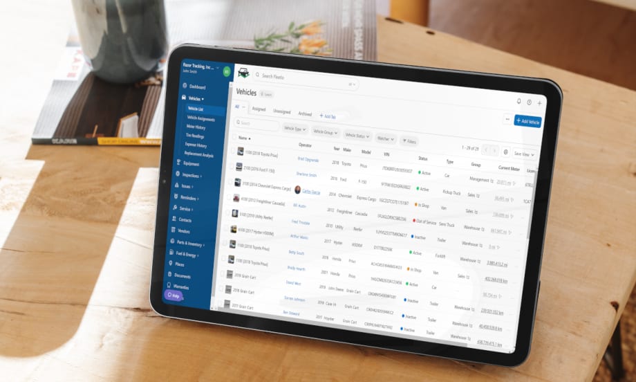 Tablet on desk with fleet management software on screen.