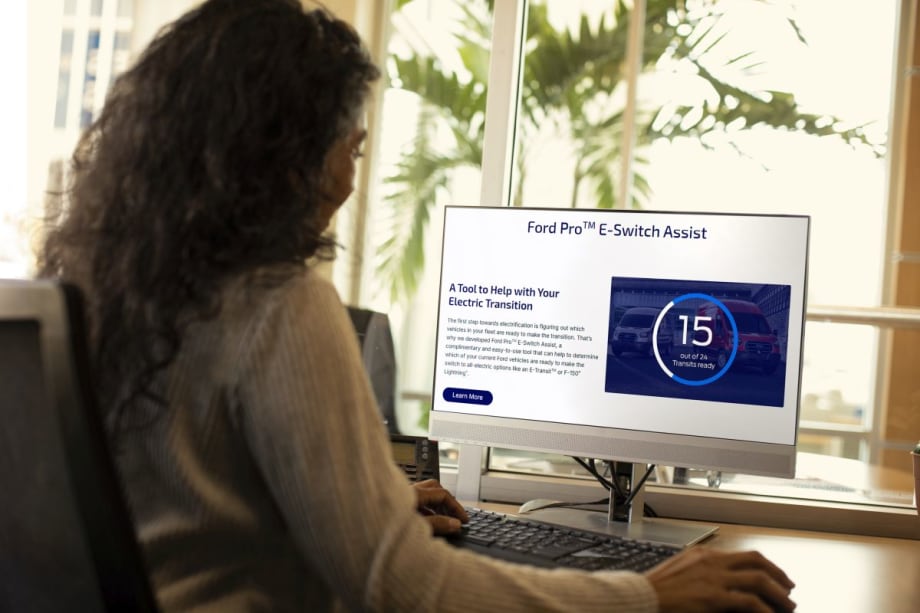 Women on computer looking at Ford Pro's E-Switch Assist