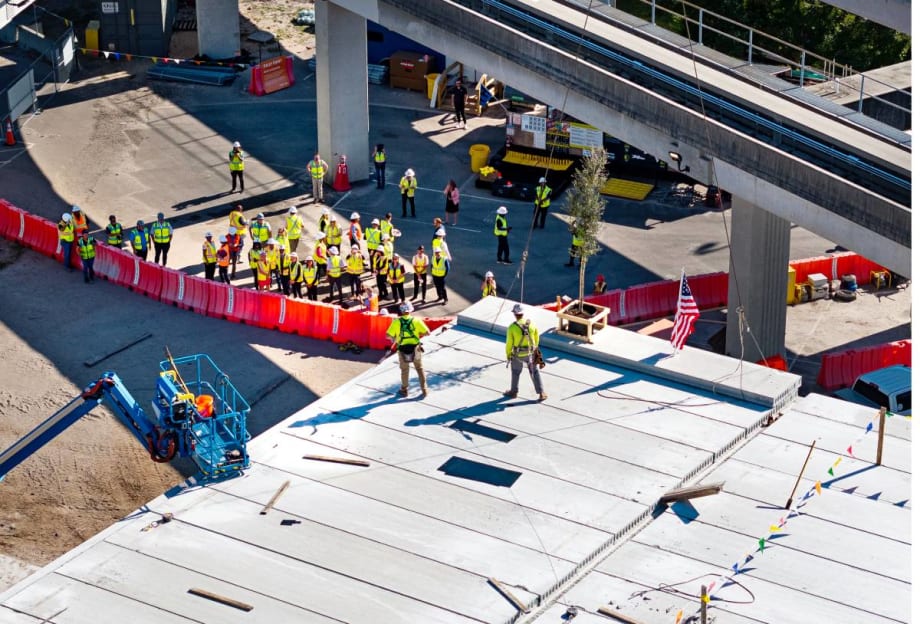 Workers gather for the AIC topping out ceremony