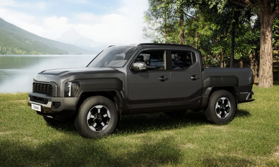 side view of compact pickup truck by a lake