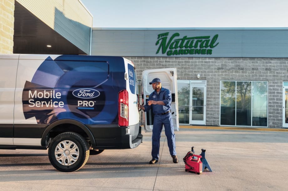 A Ford Pro Mobile Service technician working on-site at a customer’s location.