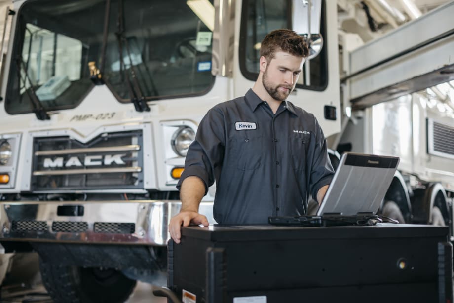 Mack Truck with technician on laptop
