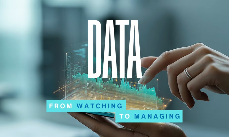 A hand interacts with a digital data display above a smartphone, symbolizing how fleets use real-time insights to manage trucks, drivers, and daily operations.