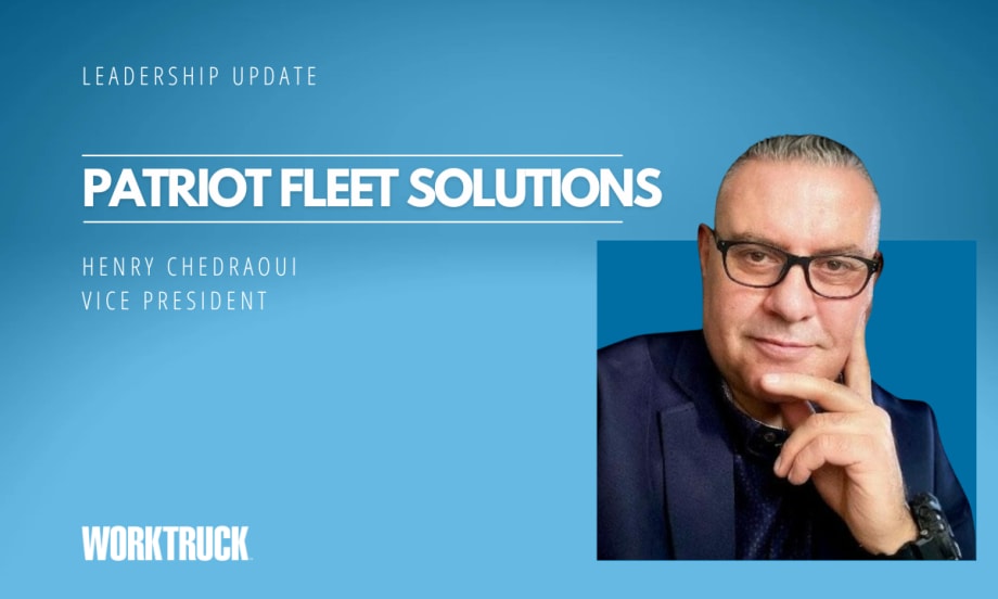 Man in business attire in front of a blue background with company name, Patriot Fleet Solutions.