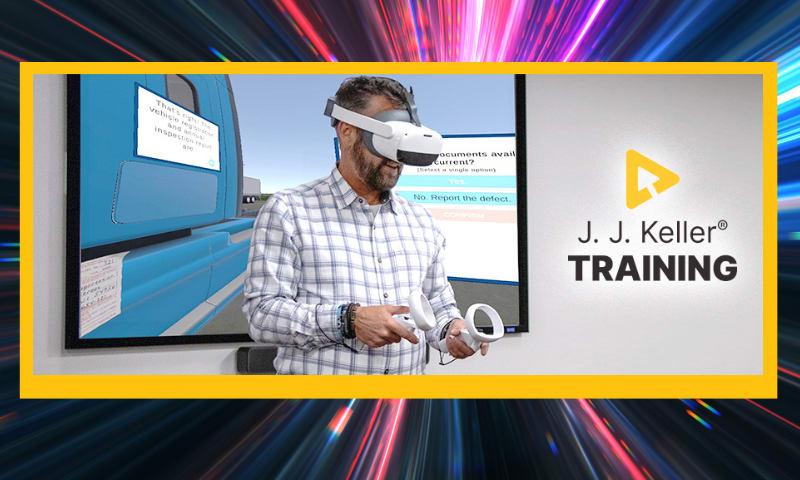 Man using VR goggles and hand controls.