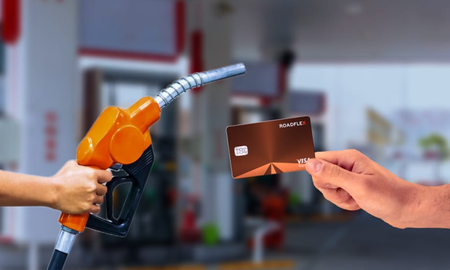 image of a fuel dispensing handle at a pump and a hand holding a fuel card.