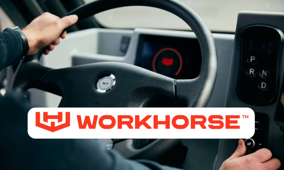 Interior photo of a truck and steering wheel with logo for Workhorse in a white box.