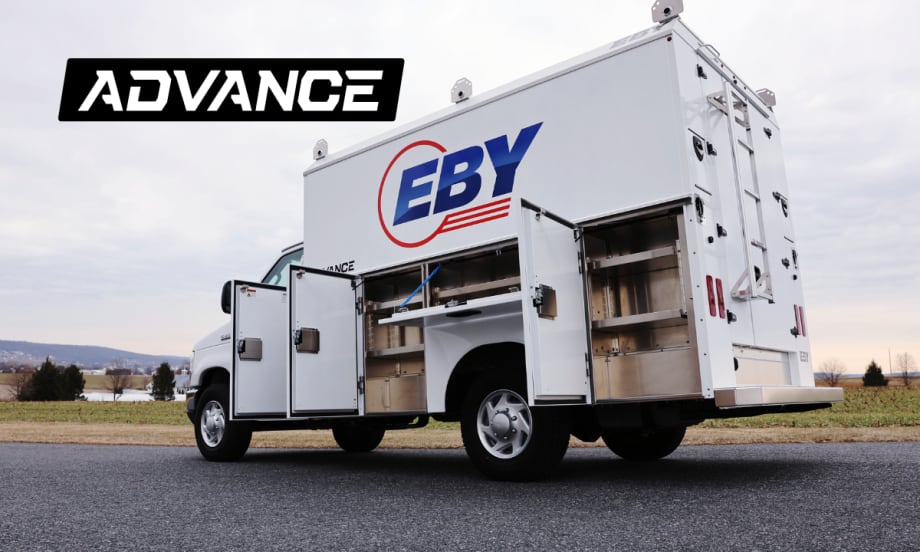 quarter-side rear view of a white service truck with cabinet doors open.